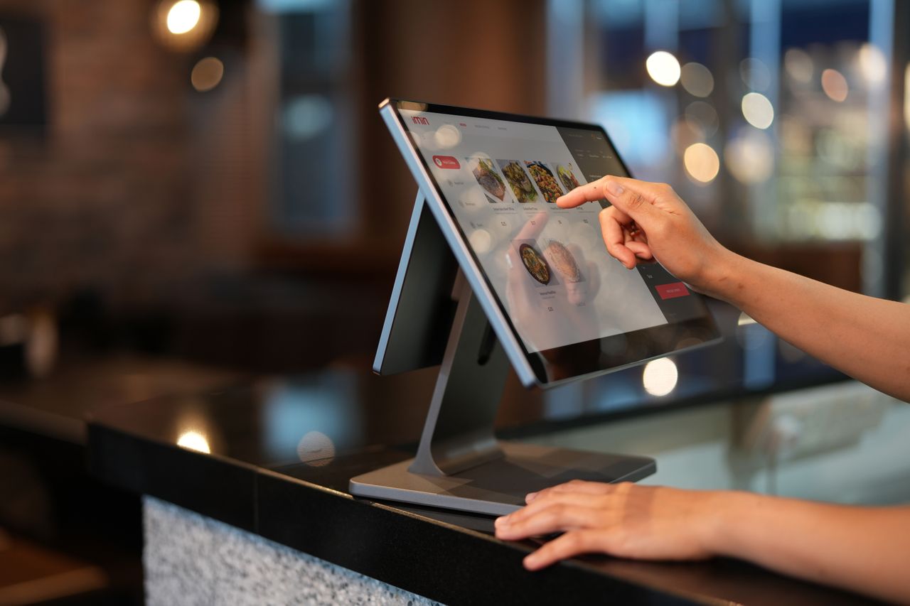 Guest placing a QR order at a restaurant table