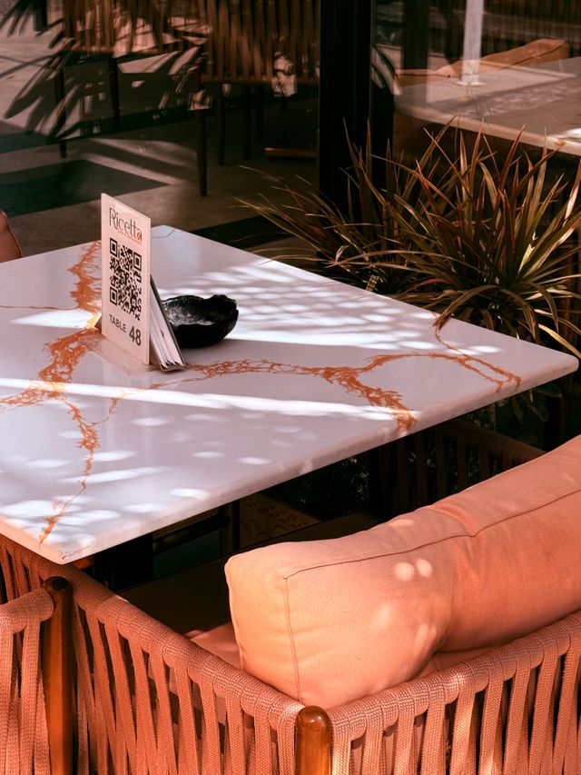 Guest scanning a QR code at a restaurant table